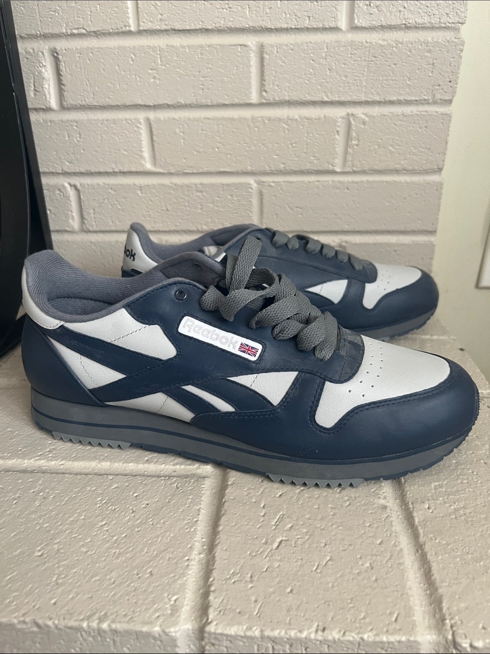 Men’s navy and grey Reebok Classic sneakers